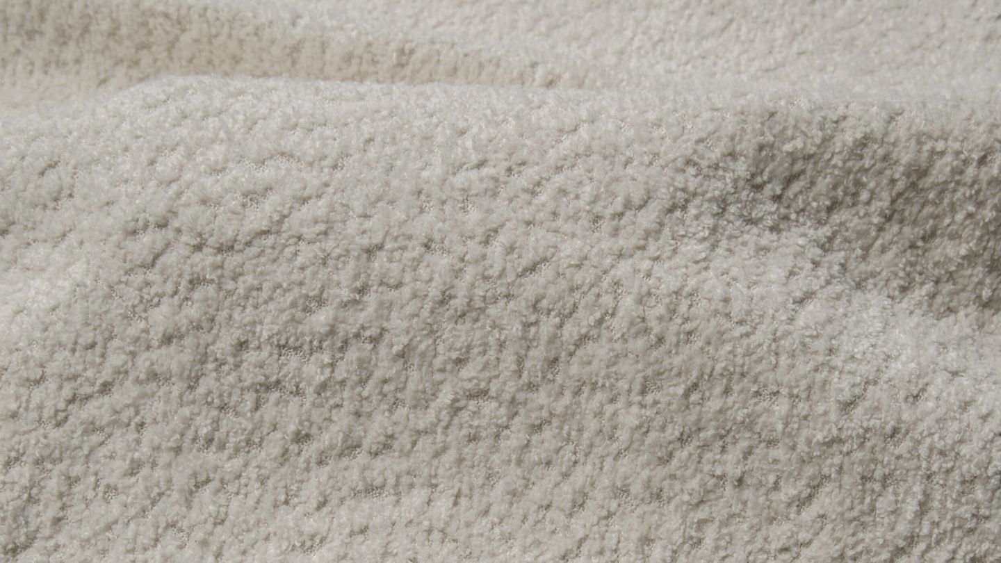 Pouf en tissu bouclé beige - Cester